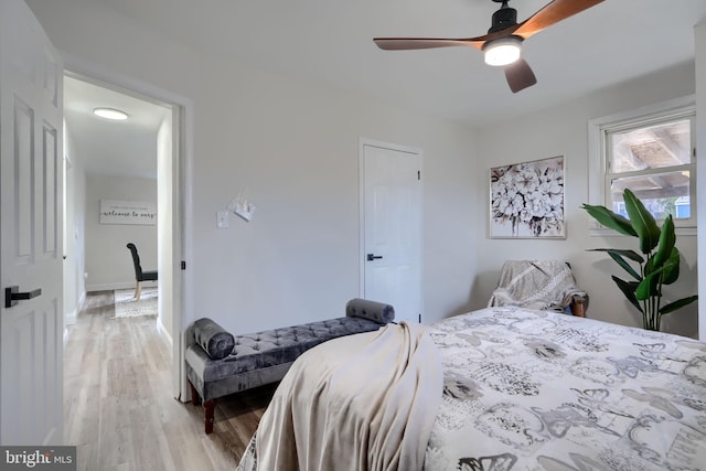 bedroom featuring light wood-style flooring and a ceiling fan