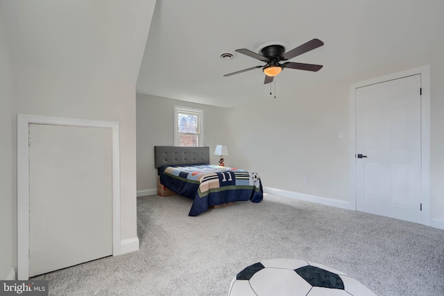 carpeted bedroom with baseboards, visible vents, and ceiling fan