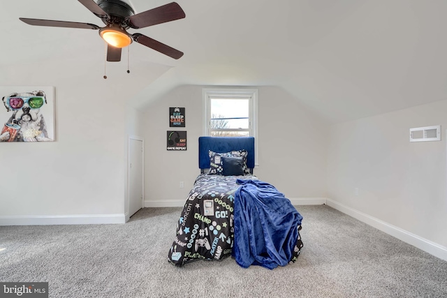 bedroom with visible vents, carpet, baseboards, ceiling fan, and vaulted ceiling