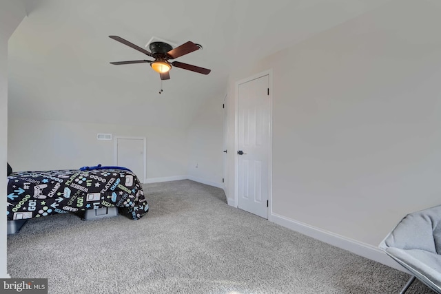 carpeted bedroom featuring ceiling fan, baseboards, and vaulted ceiling