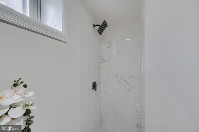 interior space featuring a tile shower