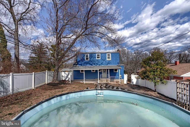 view of swimming pool featuring a fenced backyard