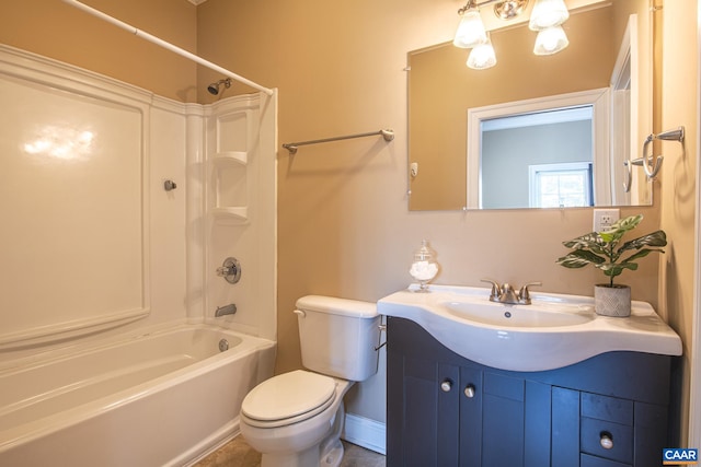 full bathroom with shower / washtub combination, toilet, vanity, and baseboards