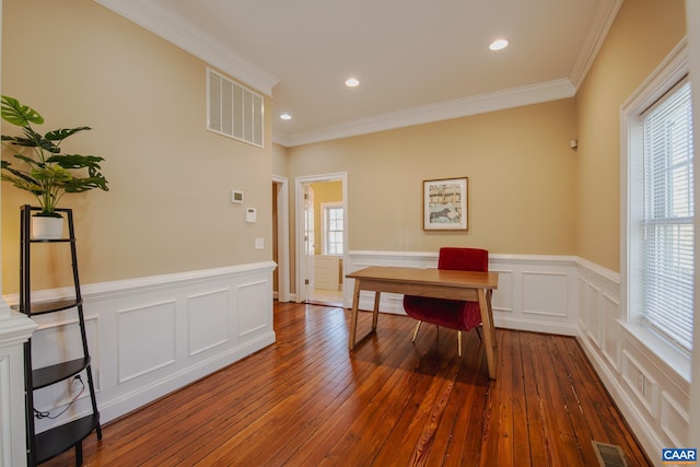 office space with visible vents, a healthy amount of sunlight, and dark wood-style flooring