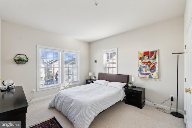 bedroom with carpet and baseboards