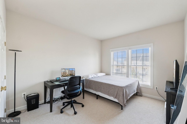 bedroom with baseboards and carpet flooring