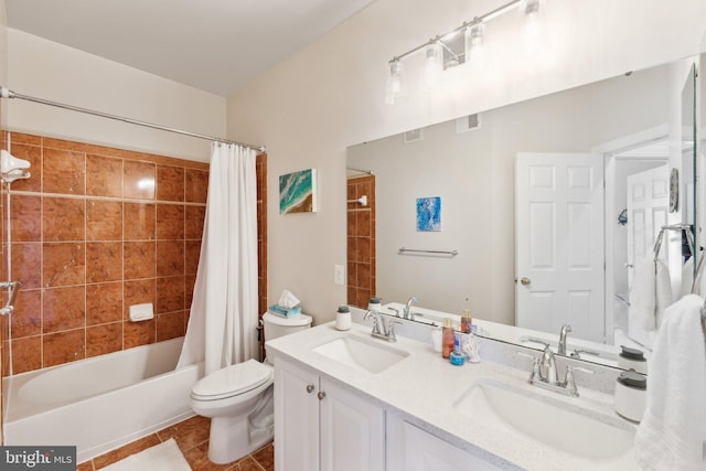 full bathroom featuring tile patterned flooring, toilet, shower / bath combo, and a sink