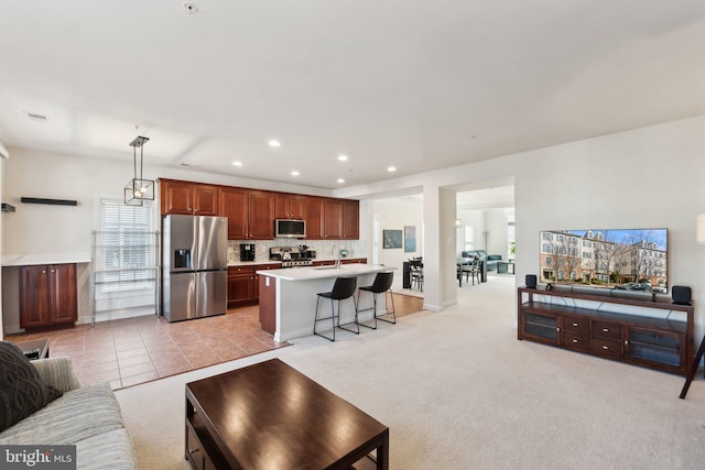 living room featuring light tile patterned floors, recessed lighting, and light carpet