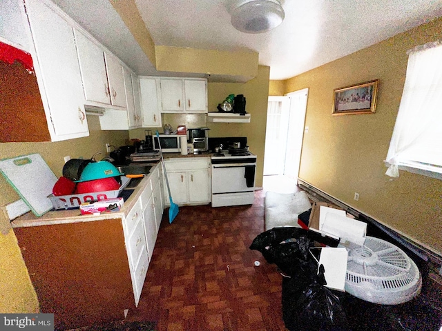 kitchen with white appliances and white cabinetry