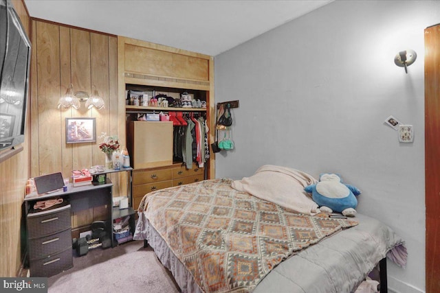 bedroom with carpet and a closet