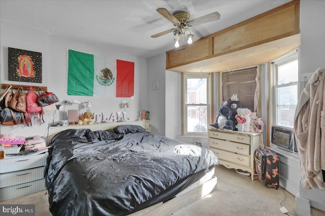 bedroom with cooling unit and ceiling fan