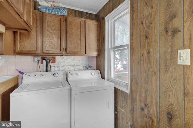 laundry room with cabinet space and washing machine and dryer