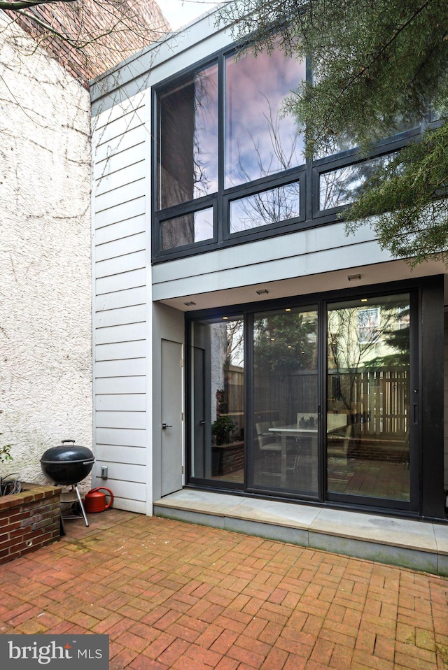 doorway to property featuring a patio area