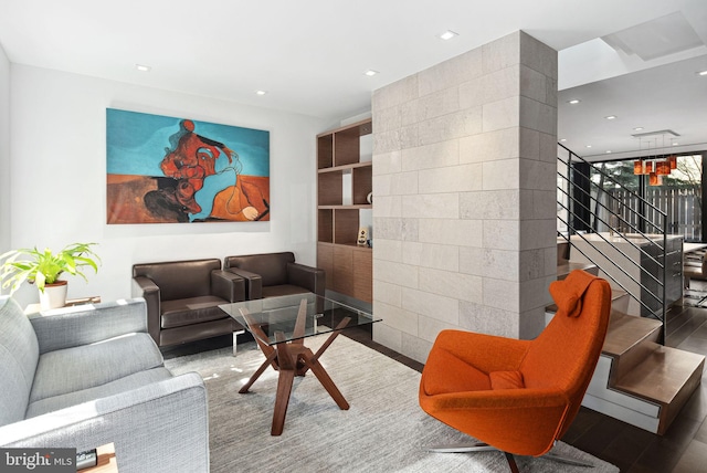 living area featuring stairway, recessed lighting, and wood finished floors