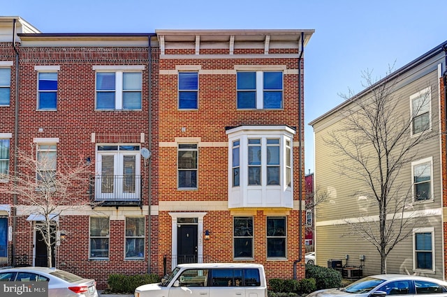 view of property featuring brick siding