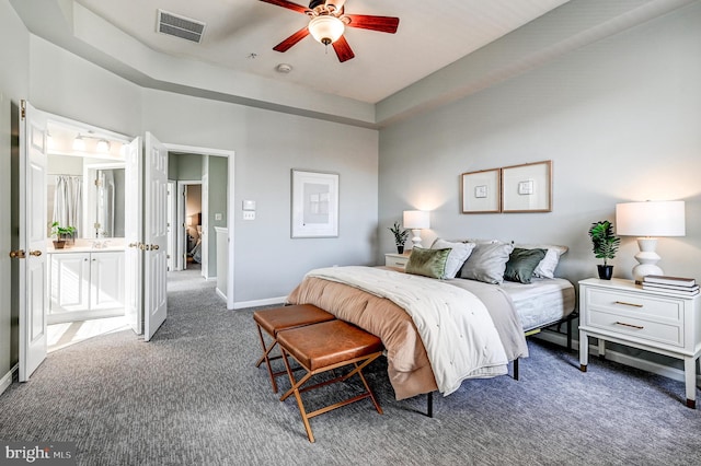 carpeted bedroom with visible vents, ceiling fan, and baseboards