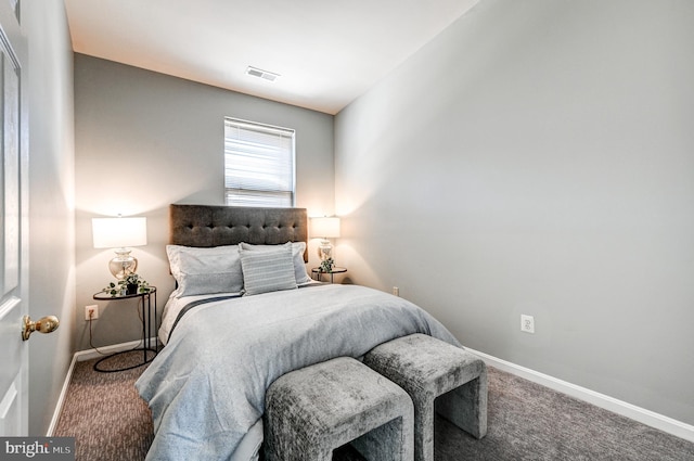 bedroom featuring visible vents, baseboards, and carpet