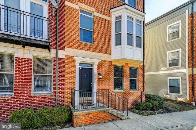 exterior space featuring brick siding