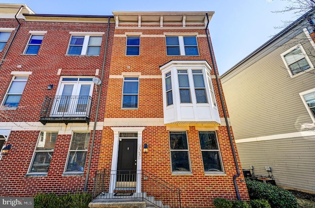 view of property with brick siding