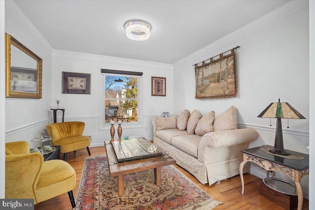 living room with wood finished floors and ornamental molding