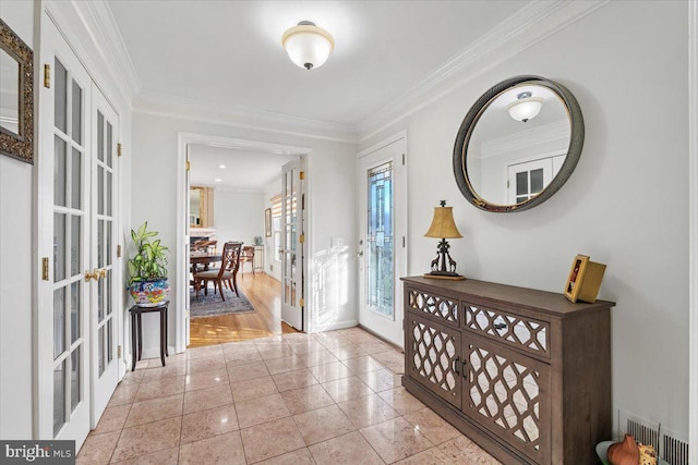 entryway featuring tile patterned flooring, french doors, visible vents, and ornamental molding