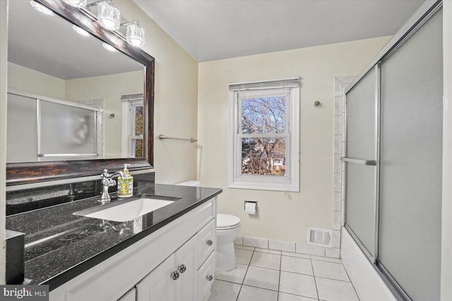 bathroom featuring tile patterned flooring, visible vents, toilet, and vanity