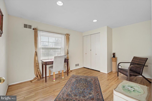 office with recessed lighting, baseboards, visible vents, and light wood finished floors