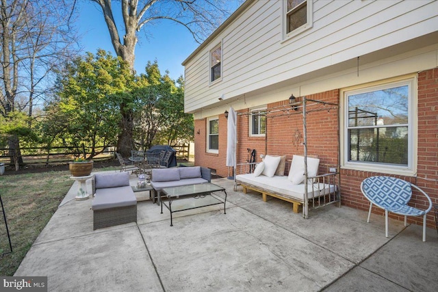 view of patio / terrace featuring an outdoor hangout area and fence