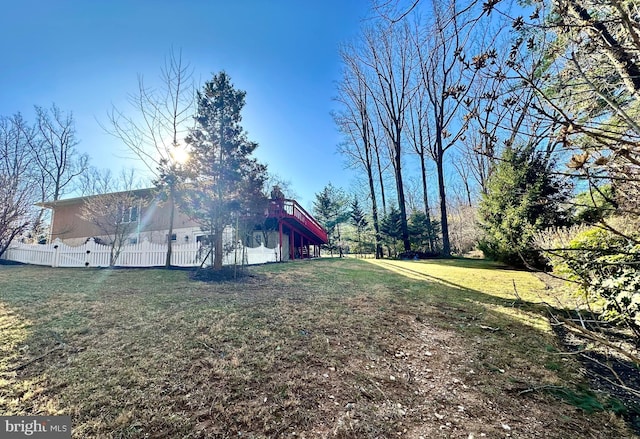 view of yard with stairs and fence