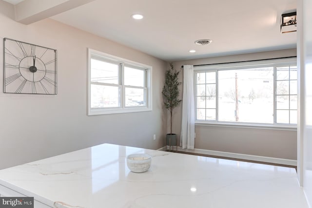 interior space with recessed lighting, visible vents, and a healthy amount of sunlight