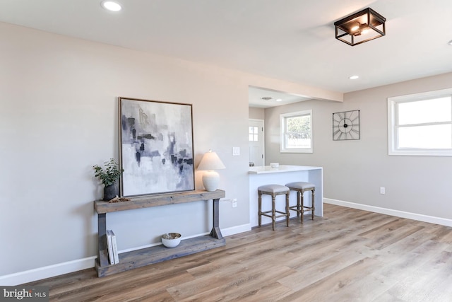 interior space featuring baseboards and wood finished floors