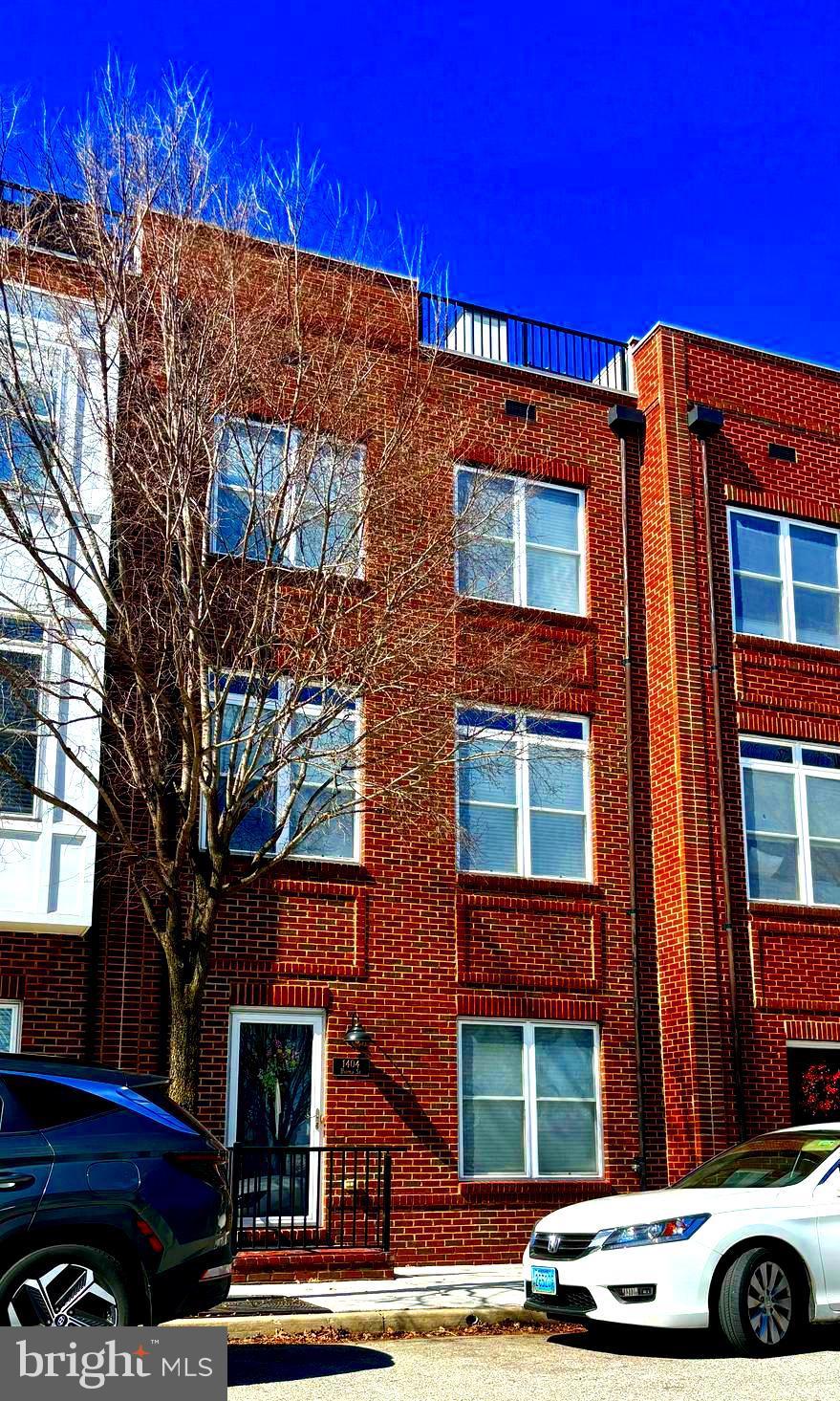 view of property with brick siding