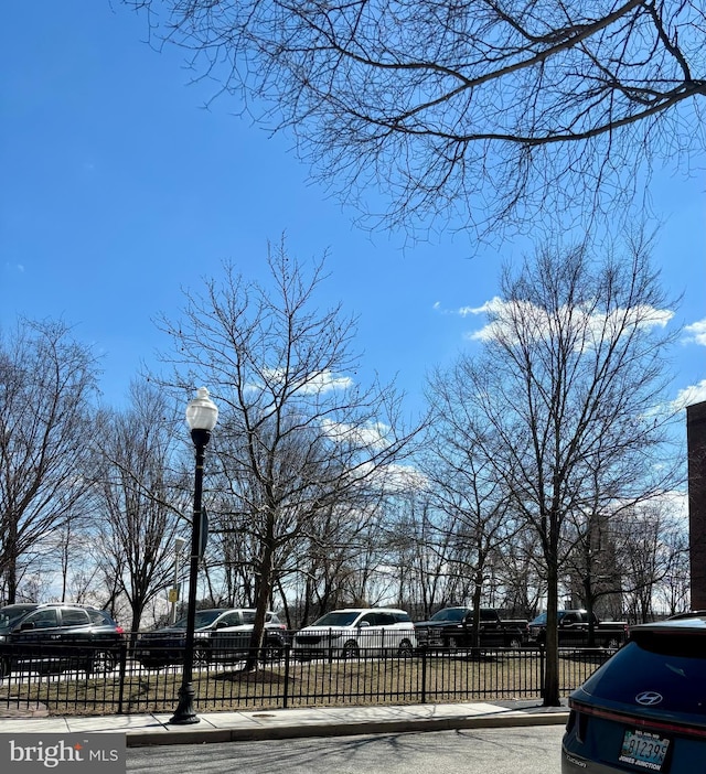 view of home's community featuring a fenced front yard