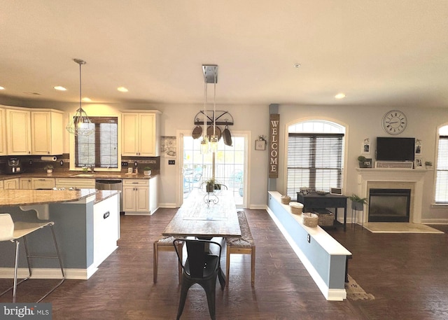 kitchen featuring dark wood-type flooring, recessed lighting, and pendant lighting