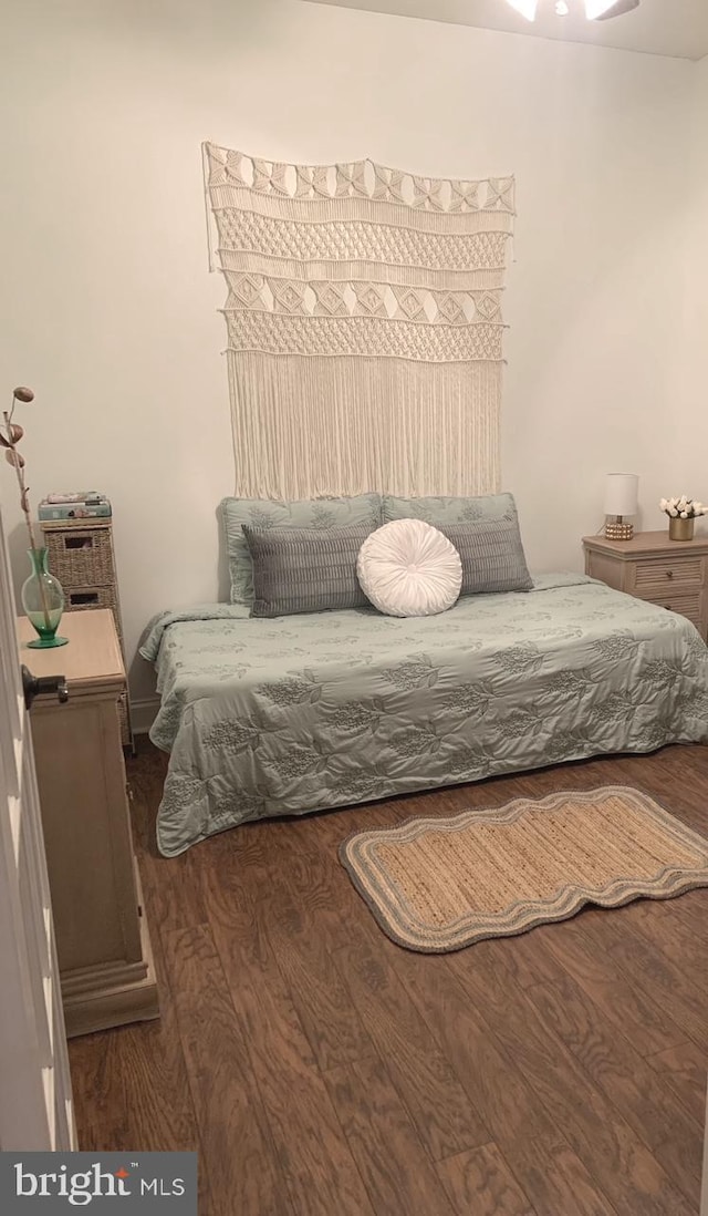 bedroom featuring wood finished floors