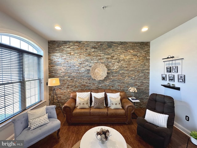 living area featuring recessed lighting, baseboards, and wood finished floors