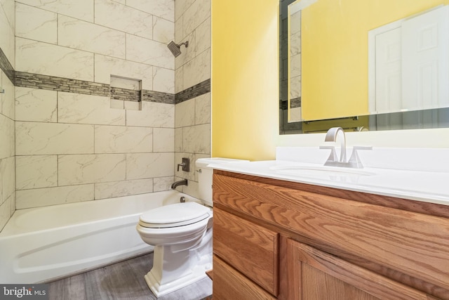 full bathroom with vanity, toilet, shower / bathtub combination, and wood finished floors