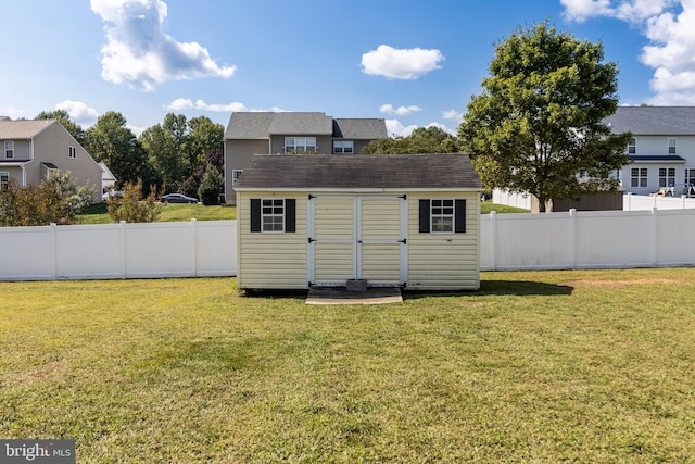 view of shed featuring a fenced backyard