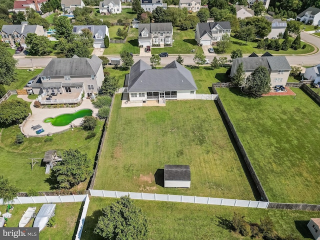 birds eye view of property with a residential view