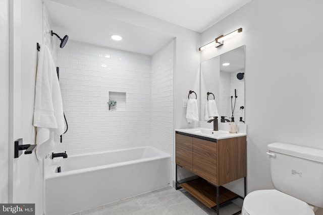 full bathroom with toilet, vanity, and washtub / shower combination