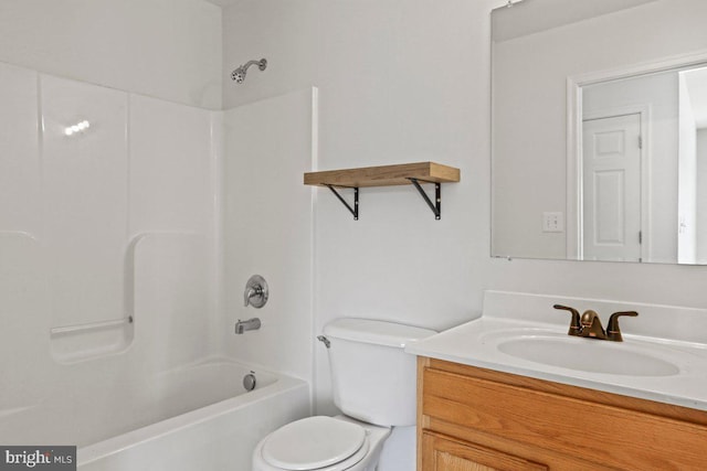 bathroom with toilet, vanity, and shower / bathing tub combination