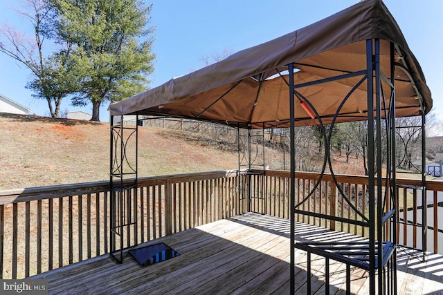 wooden terrace with a gazebo