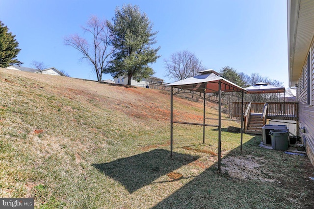 view of yard with a gazebo and a deck