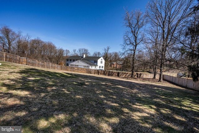 view of yard featuring a fenced backyard