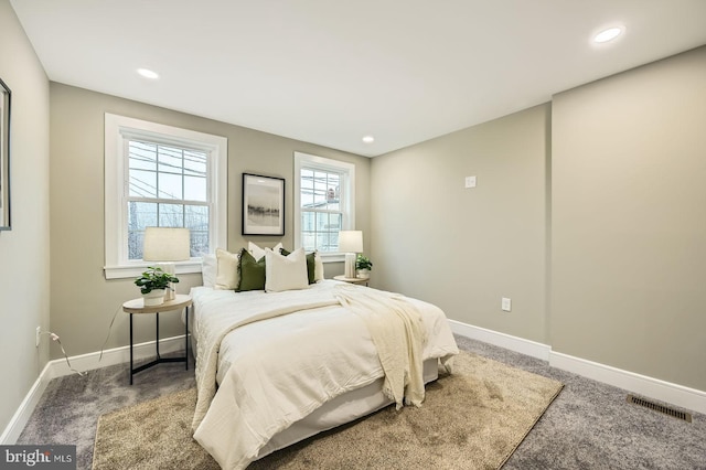 carpeted bedroom with visible vents, recessed lighting, and baseboards