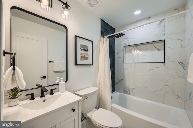 full bathroom featuring visible vents, toilet, vanity, and shower / bath combo