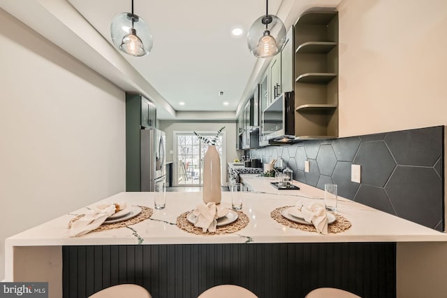 bathroom featuring recessed lighting and tasteful backsplash