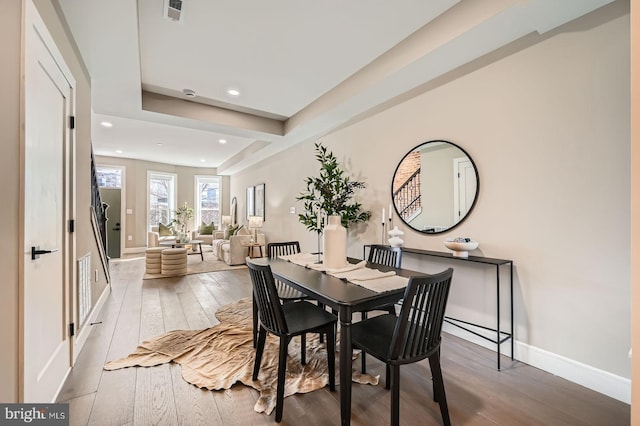 dining space featuring visible vents, recessed lighting, baseboards, and wood-type flooring