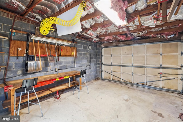 garage with concrete block wall