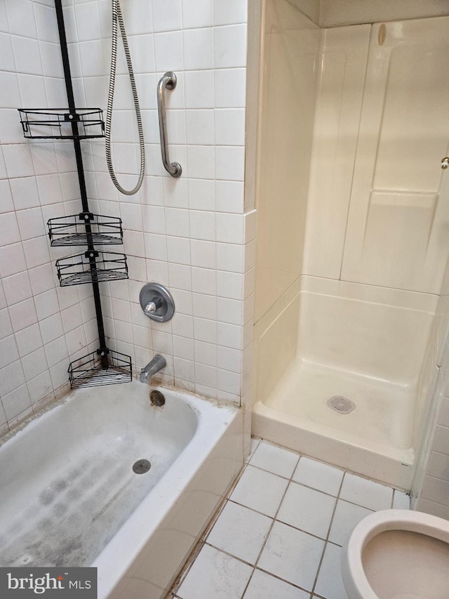 full bathroom featuring tile patterned flooring